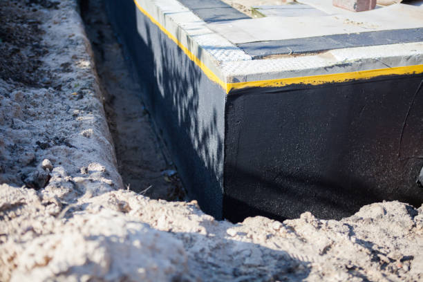 Professional Waterproofing technician working in Maumee, OH